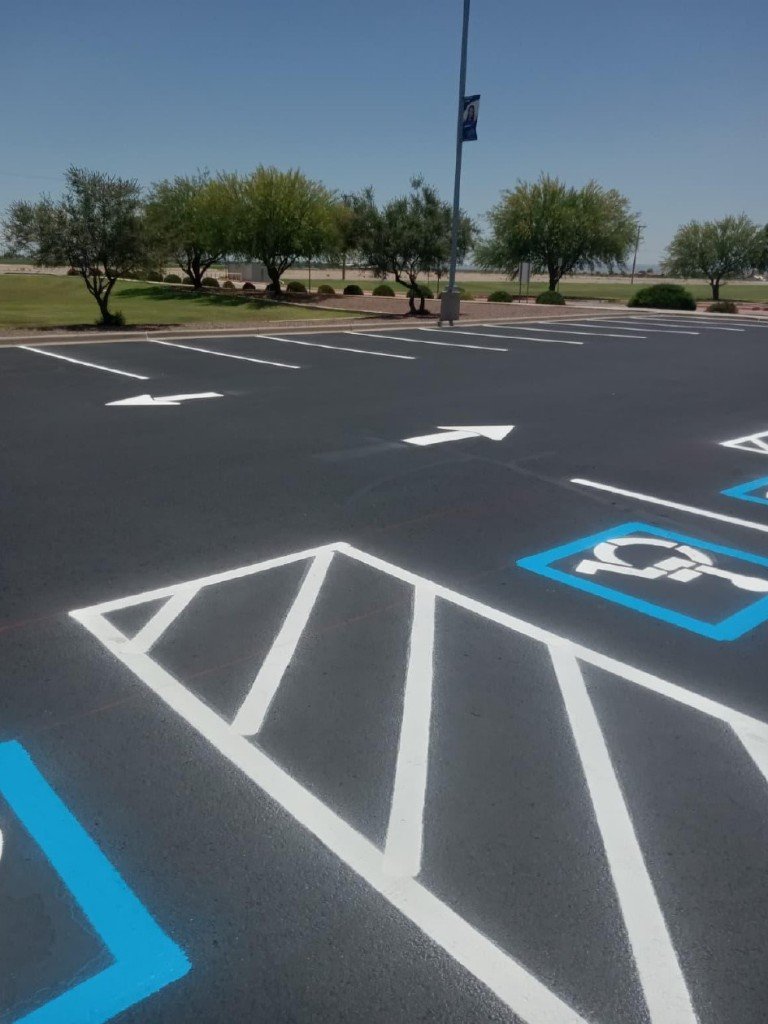 Completed commercial asphalt parking lot with professional striping